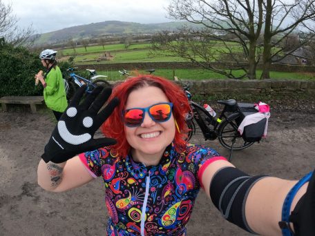 Smiling woman in cycling gear.